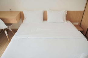 Fully Furnished with Cozy Design 2BR at Sky House BSD Apartment By Travelio